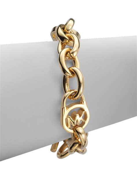 gold michael kors heritage logo lock chain bracelet|Michael Kors charm bracelet.